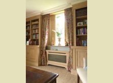 Pine study with bookcases, window shutters and radiator cover